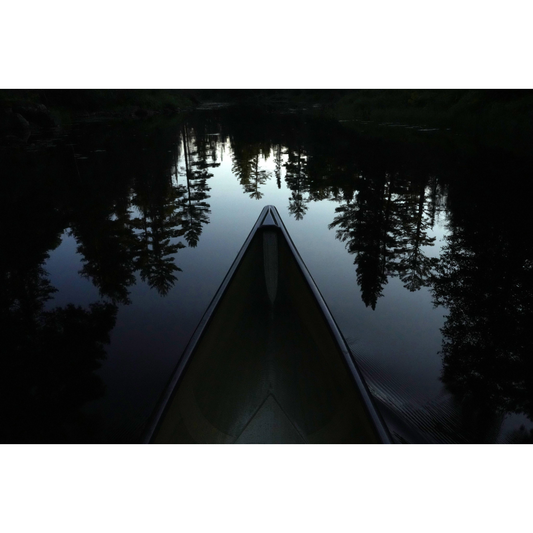 Canoe Glides on Lake One Photo Print